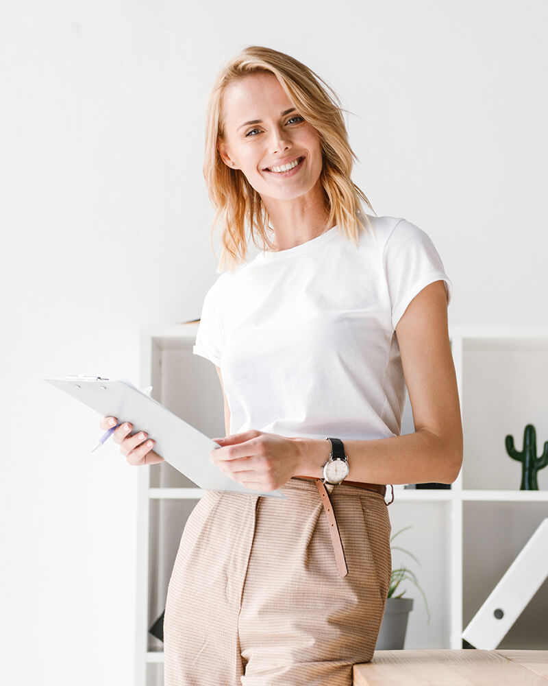 smiling-businesswoman-holding-folder-8PBUAH4.jpg